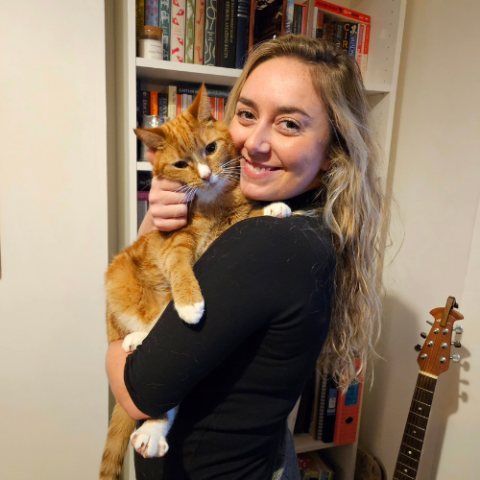 Lucy Williams holding an adorable brown kitten